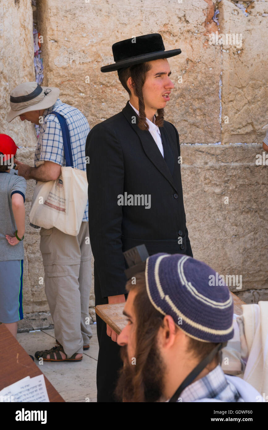 Israel Jerusalem Old City Western Wall religious orthodox Haredi Hasidic Jew Jewish man with black hat & payot peyos forelocks Stock Photo