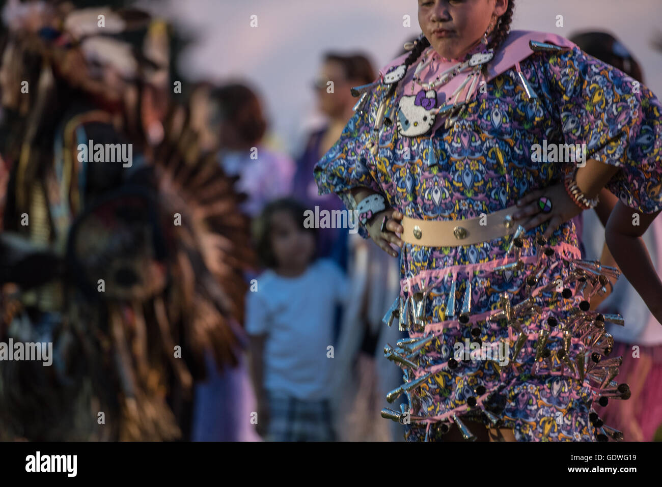 Native American woman performing jingle dress dance during Sac & Fox ...