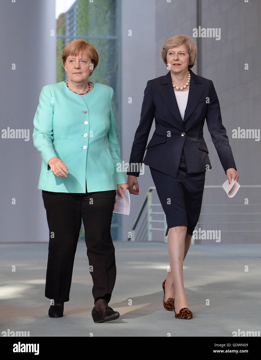 Prime Minister Theresa May and German Chancellor Angela Merkel arrive to hold a news conference at the Chancellery in Berlin after having talks. Stock Photo