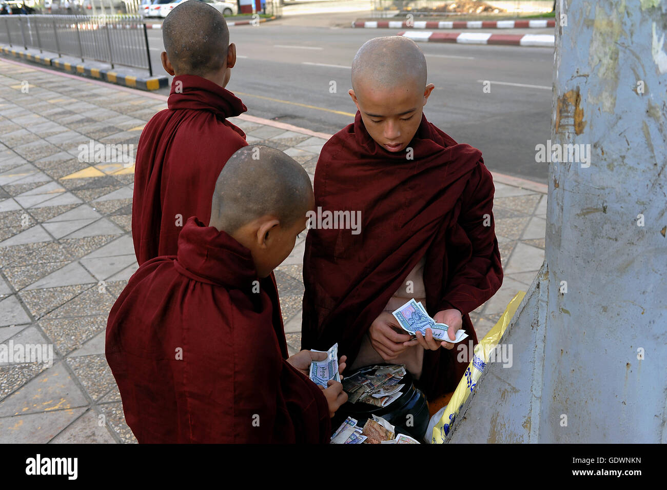 Monks and money Stock Photo Alamy
