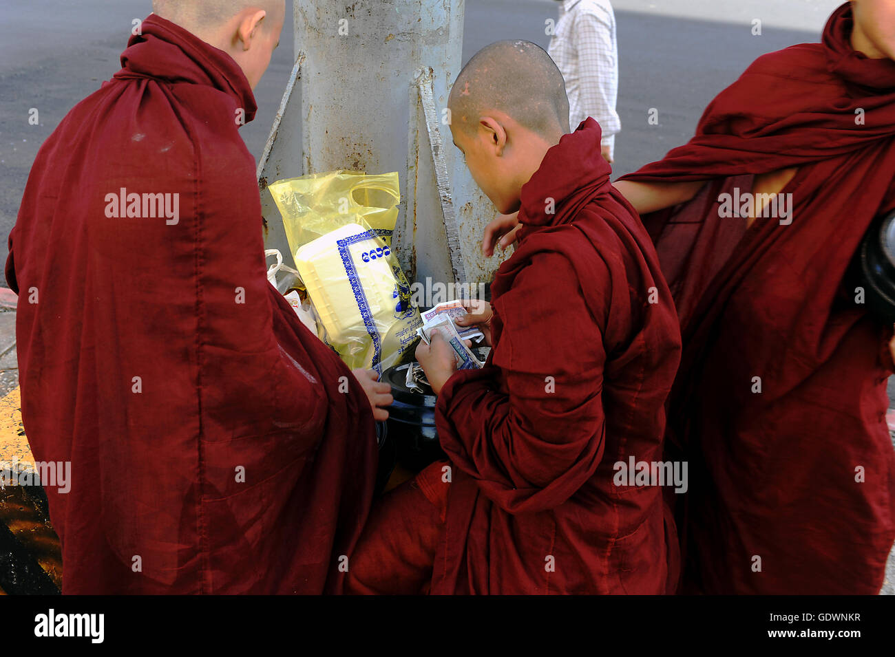 Monks and money Stock Photo Alamy