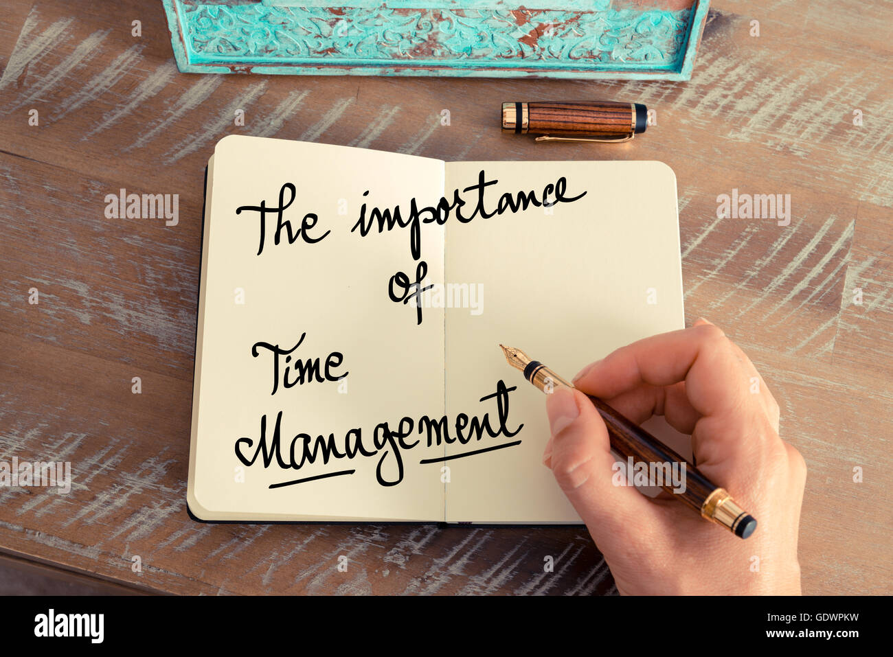 Handwritten text The Importance Of Time Management as concept image. Stock Photo