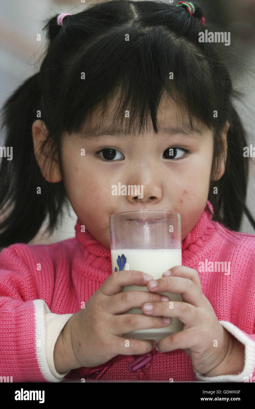 Girl drinks milk Stock Photo Alamy
