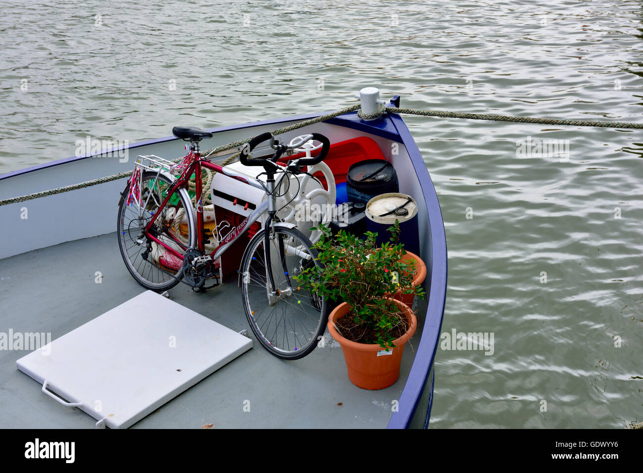 Bow of boat with bicycle on it Stock Photo