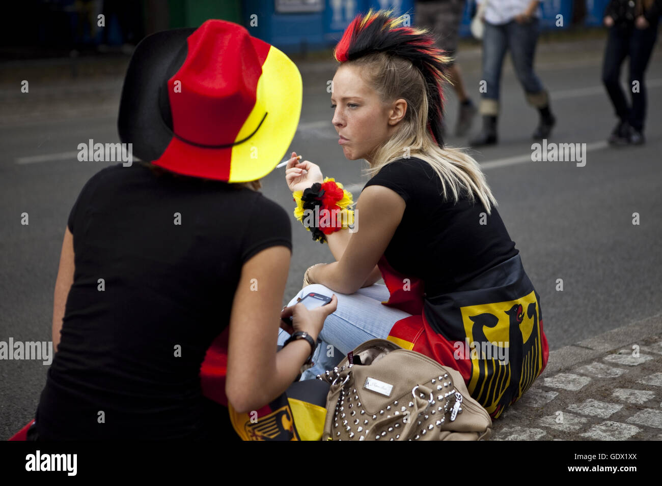 Two women sit on the German Fan Mile (Fanmeile) at the World Cup in Berlin, German, 2010 Stock Photo