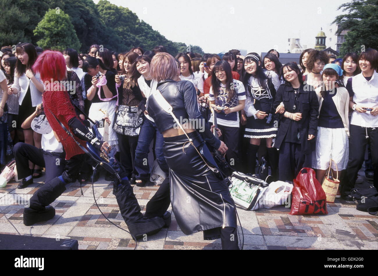 a Japanese Youth Punk Band plays on a square in the City of Tokyo in ...