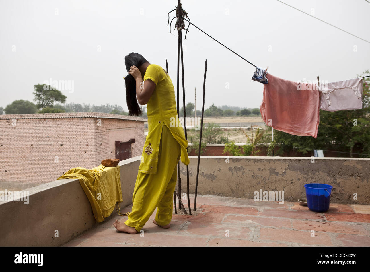 Indian woman standing in balcony hi-res stock photography and images ...
