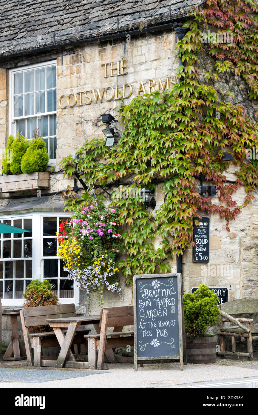 Hanging basket and floral display outside The Cotswolds Arms pub, Burford, Oxfordshire, England Stock Photo