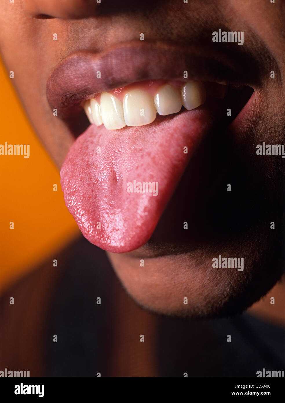 Closeup of man sticking his tongue out Stock Photo