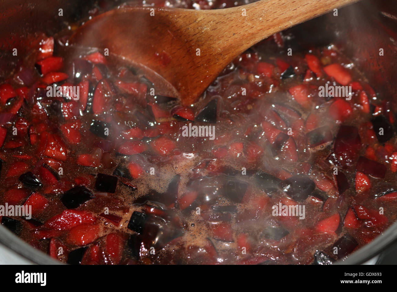 Australian Bush Food, Davidsons Plum diced and being made into Chutney Stock Photo