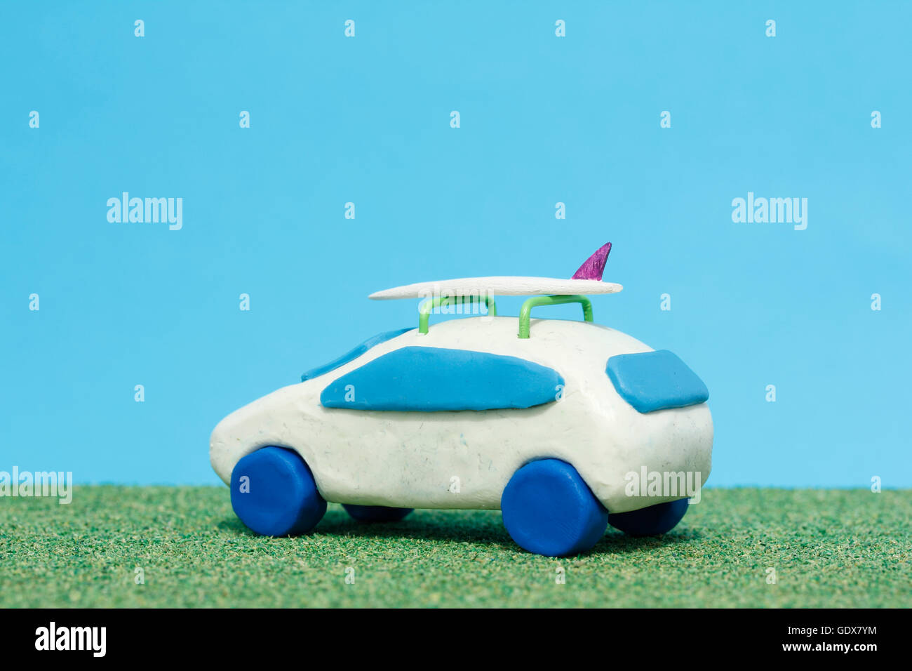 Plasticine Car and Balsa Wood Surfboard Stock Photo