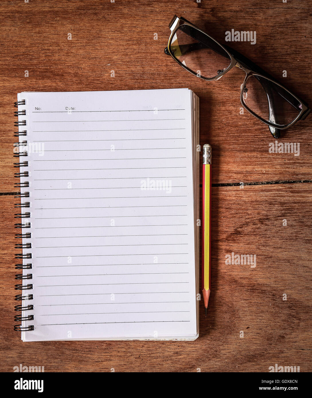 Notepad with a spiral binding on wood table Stock Photo Alamy