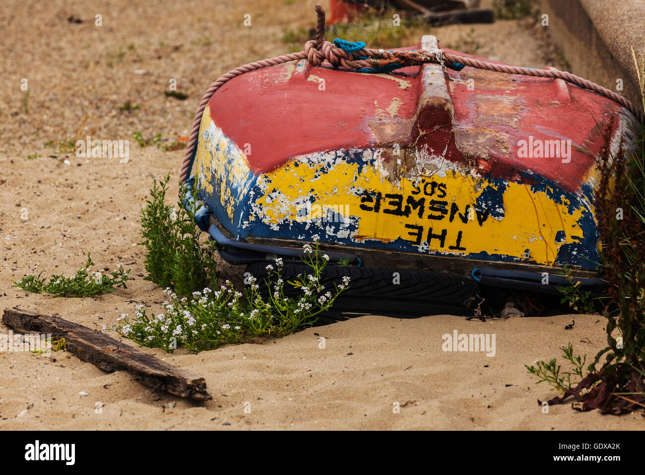 Old Dinghy Lying Upside Down on Beach Stock Photo Alamy