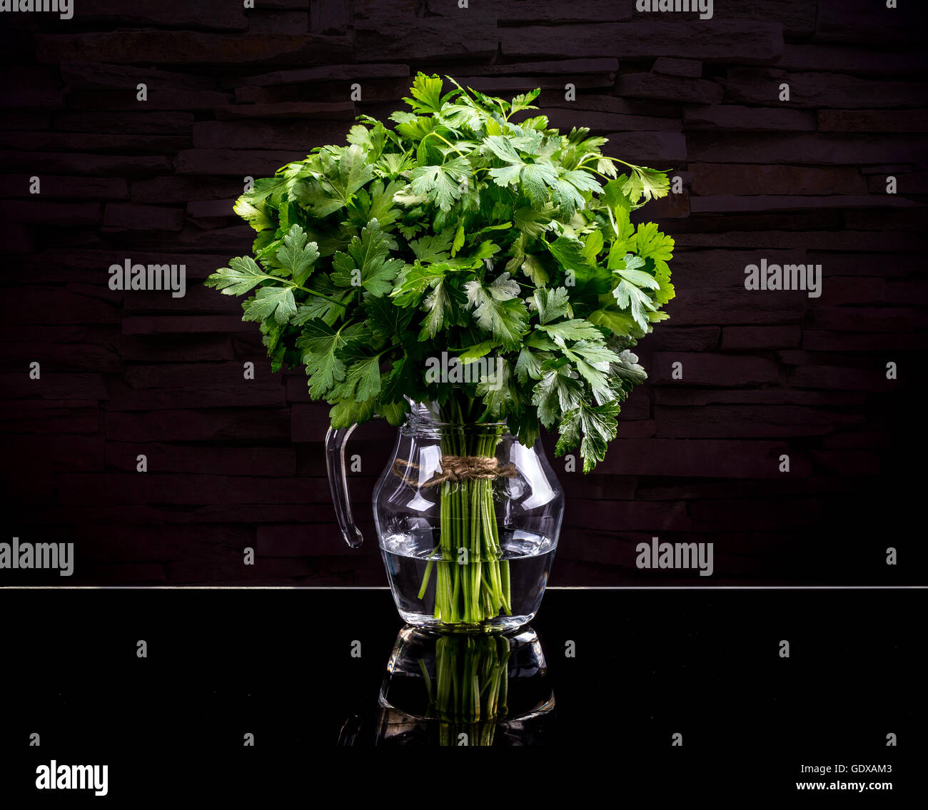 Bunch of fresh green parsley on black background Stock Photo - Alamy