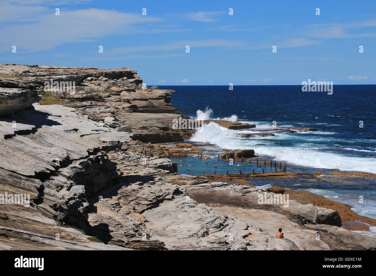Blue pacific and rock pool. Coastal scene in Sydney. Stock Photo