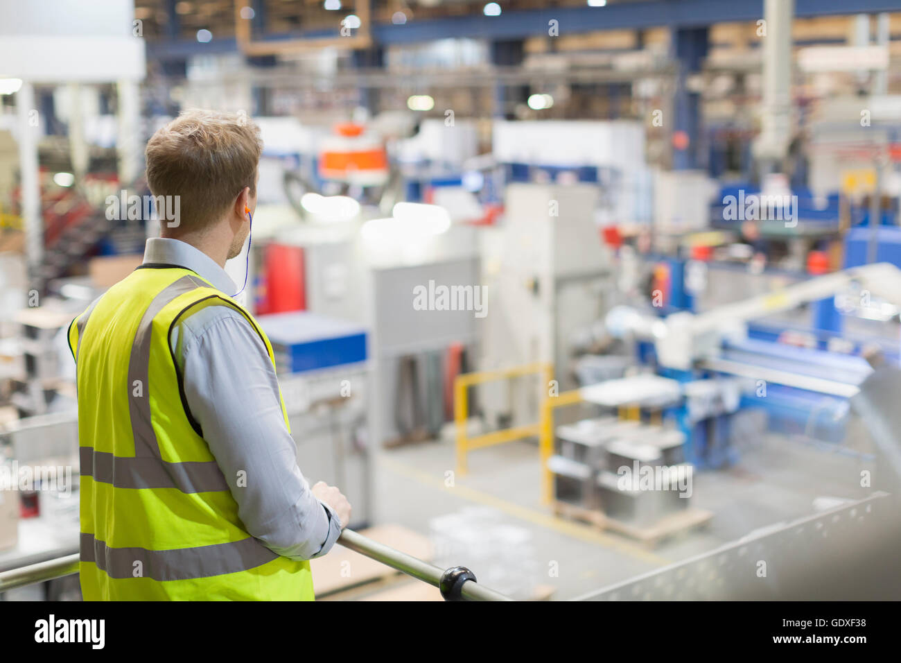 Supervisor on platform over steel factory Stock Photo