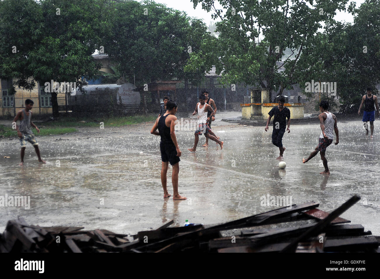 Football in the rain Stock Photo Alamy