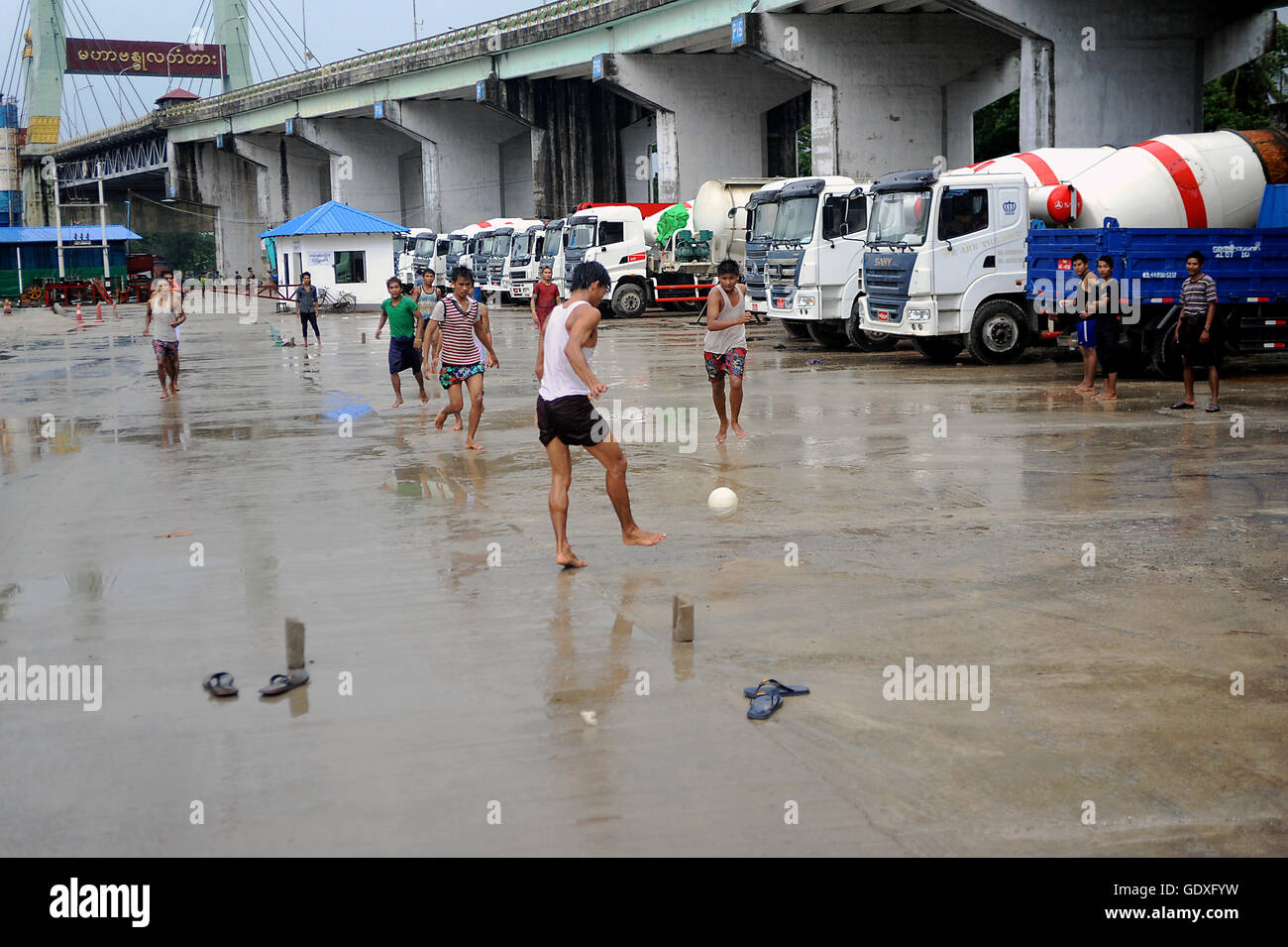 Football in the rain Stock Photo Alamy