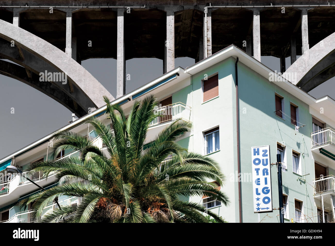 Hotel Zurigo under a highway bridge in Liguria, Italy, 2012 Stock Photo