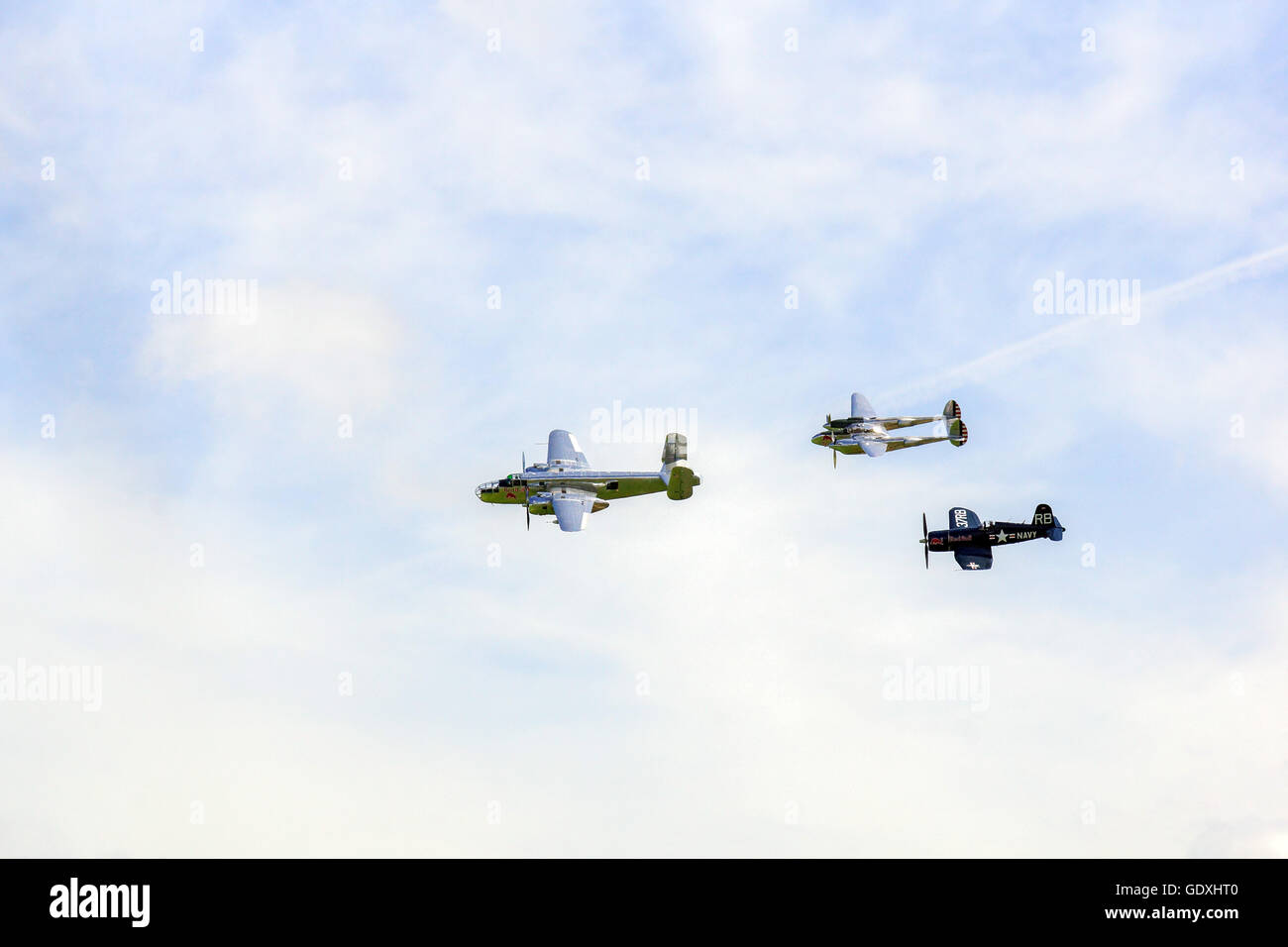 B25 Mitchell, P38 Lightning, FU-4 Corsair in formation at the Flying Legends RAF Duxford Stock Photo