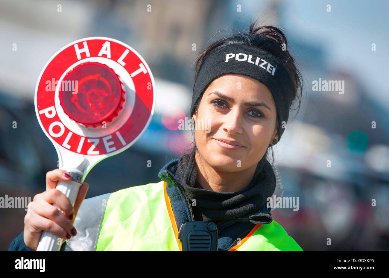 Police Signalling Disc Policewoman with signalling disc during a road check Stock Photo - Alamy