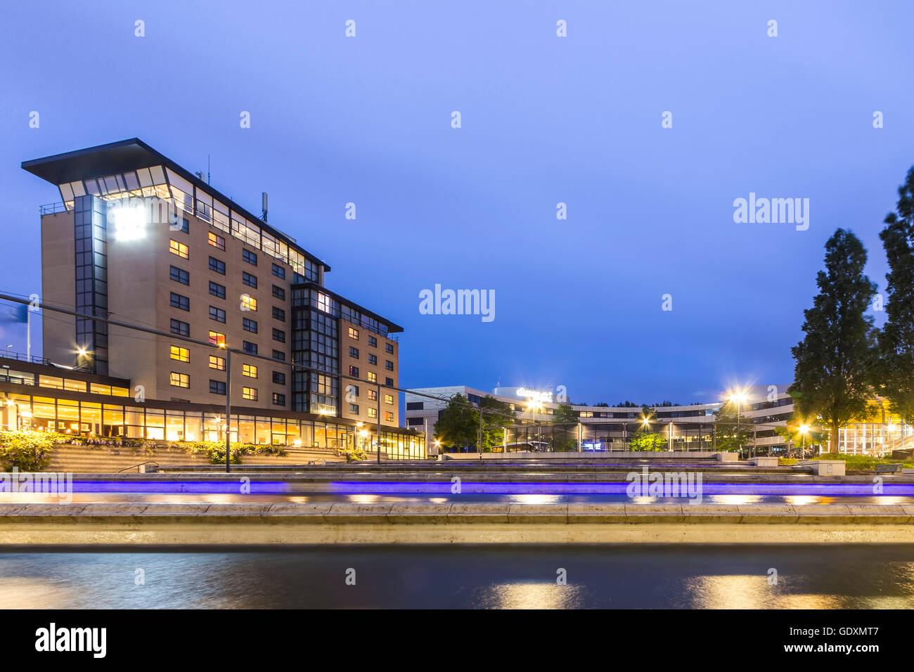 Modern concrete water art structure with illumination at night at Zoetermeer, the Netherlands. Stock Photo