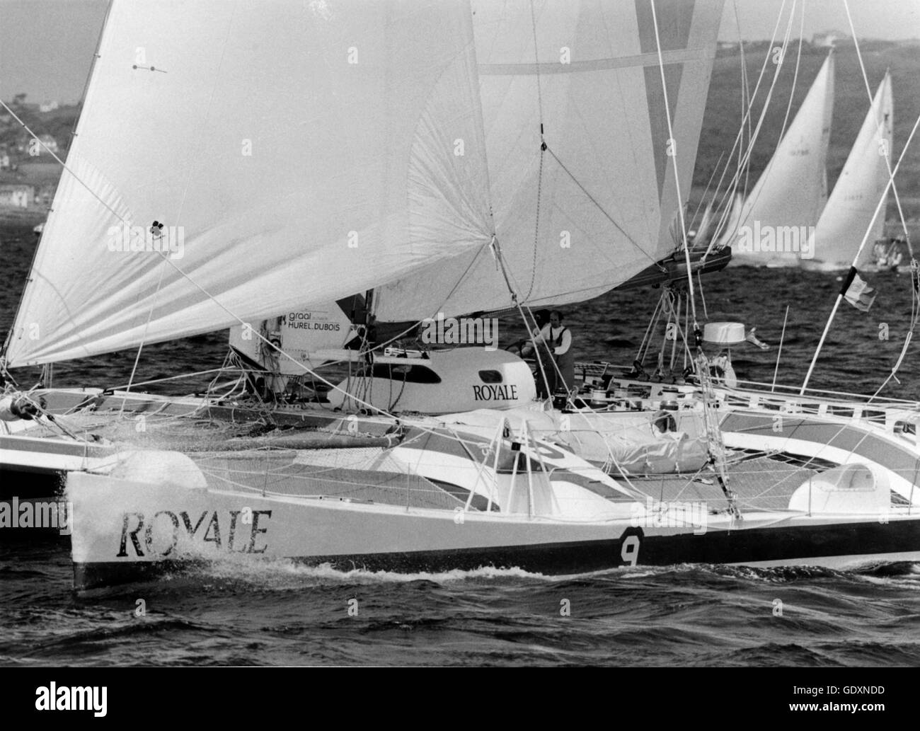 AJAX NEWS PHOTOS. 8TH JUNE 1986. PLYMOUTH, ENGLAND - LOIC CARADEC OF LA TRINITE FRANCE, SKIPPER OF THE LARGEST ENTRY IN THIS YEAR'S TWO-STAR TRANSATLANTIC RACE WHICH BEGAN TODAY. THE 85 FT ROYALE LEAD A FIELD OF 49 STARTERS OUT OF PLYMOUTH SOUND. OLIVIER DESPAGNE IS CARADEC'S CREW. PHOTO:JONATHAN ESTLAND/AJAX REF:HDD/WPX/2 STAR 86 Stock Photo