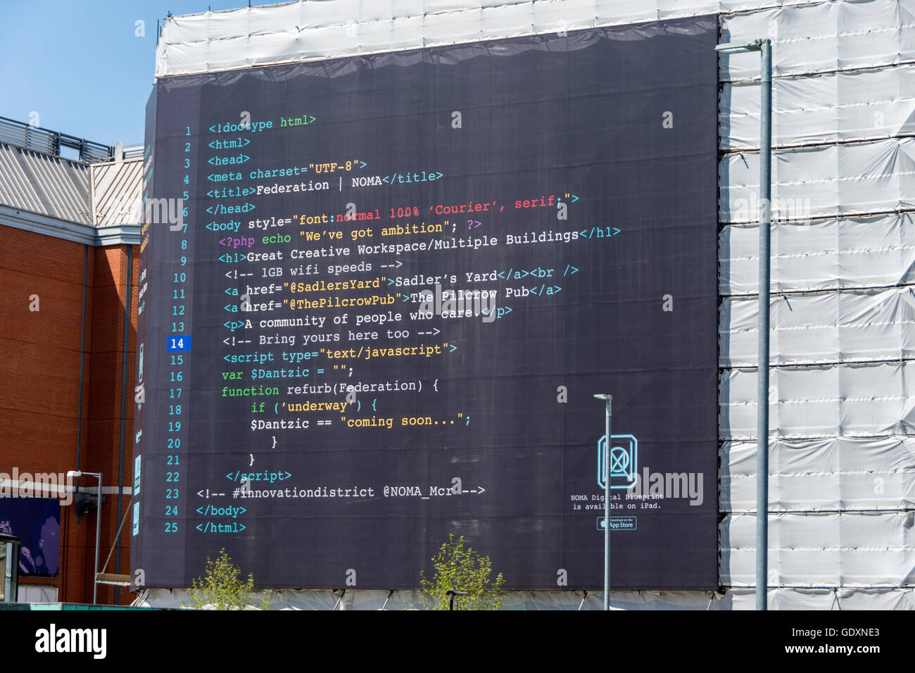 A banner in the form of HTML code on scaffolding on the Hanover building, Dantzic Street, Manchester, England, UK Stock Photo