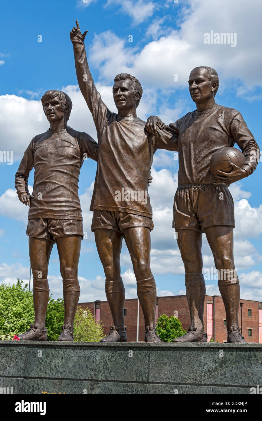 'The United Trinity', a sculpture by Philip Jackson, at the Manchester United stadium, Old Trafford, Manchester, England, UK. Stock Photo