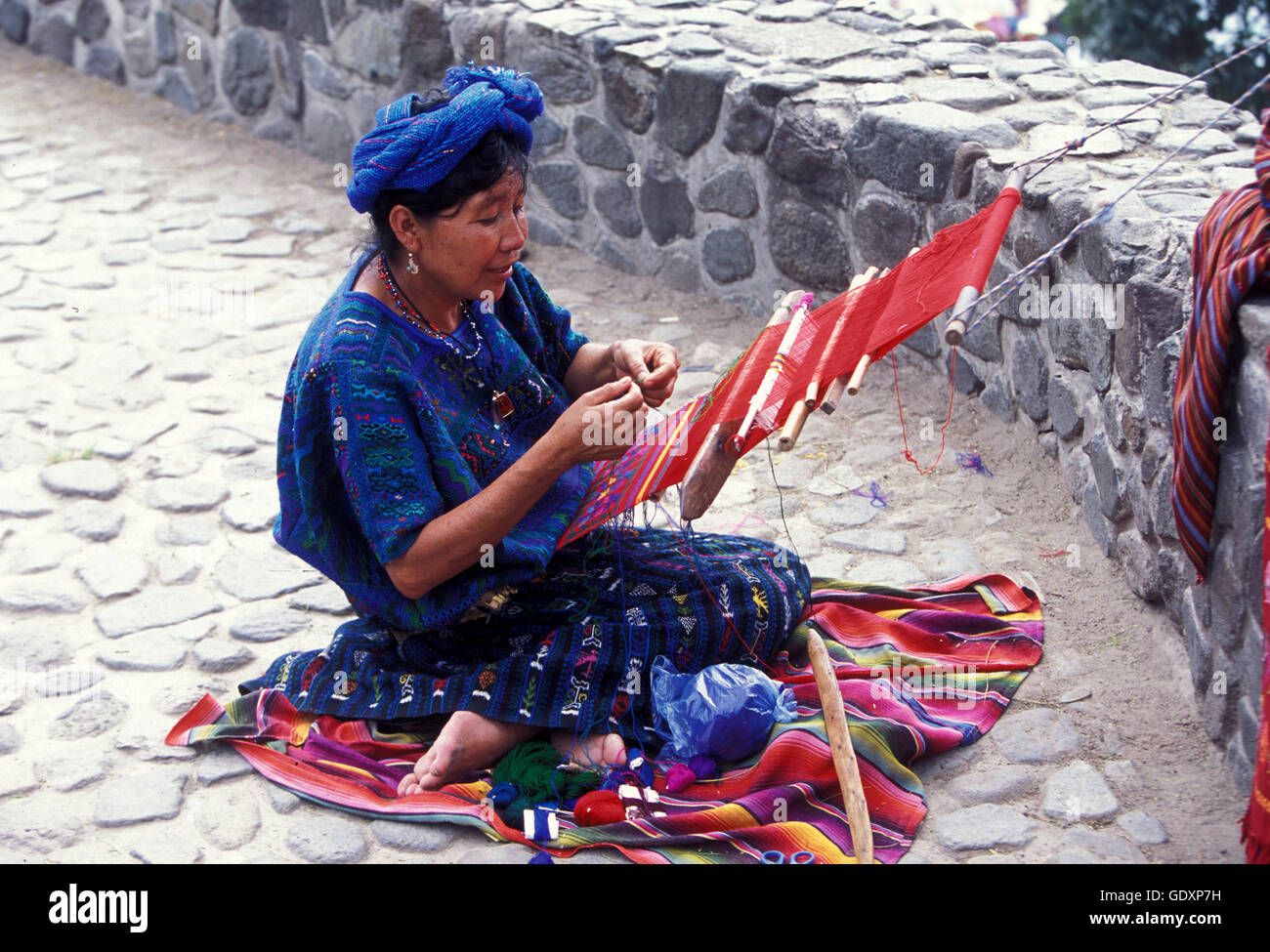 a women works in traditional clotes in the Village of  Panajachel in Guatemala in central America. Stock Photo
