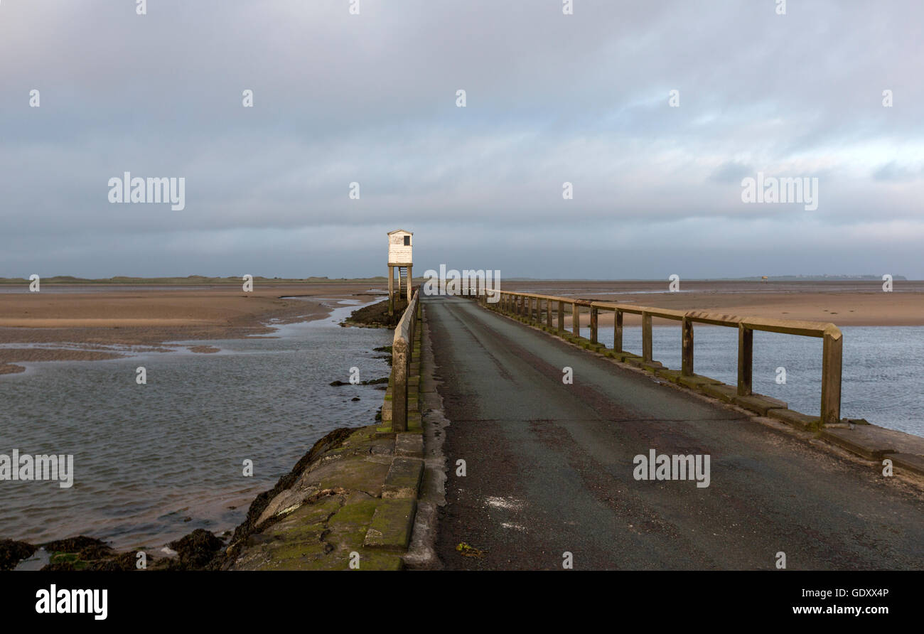 Road in low tide to The Holy Island of Lindisfarne, Northumberland, England, UK Stock Photo