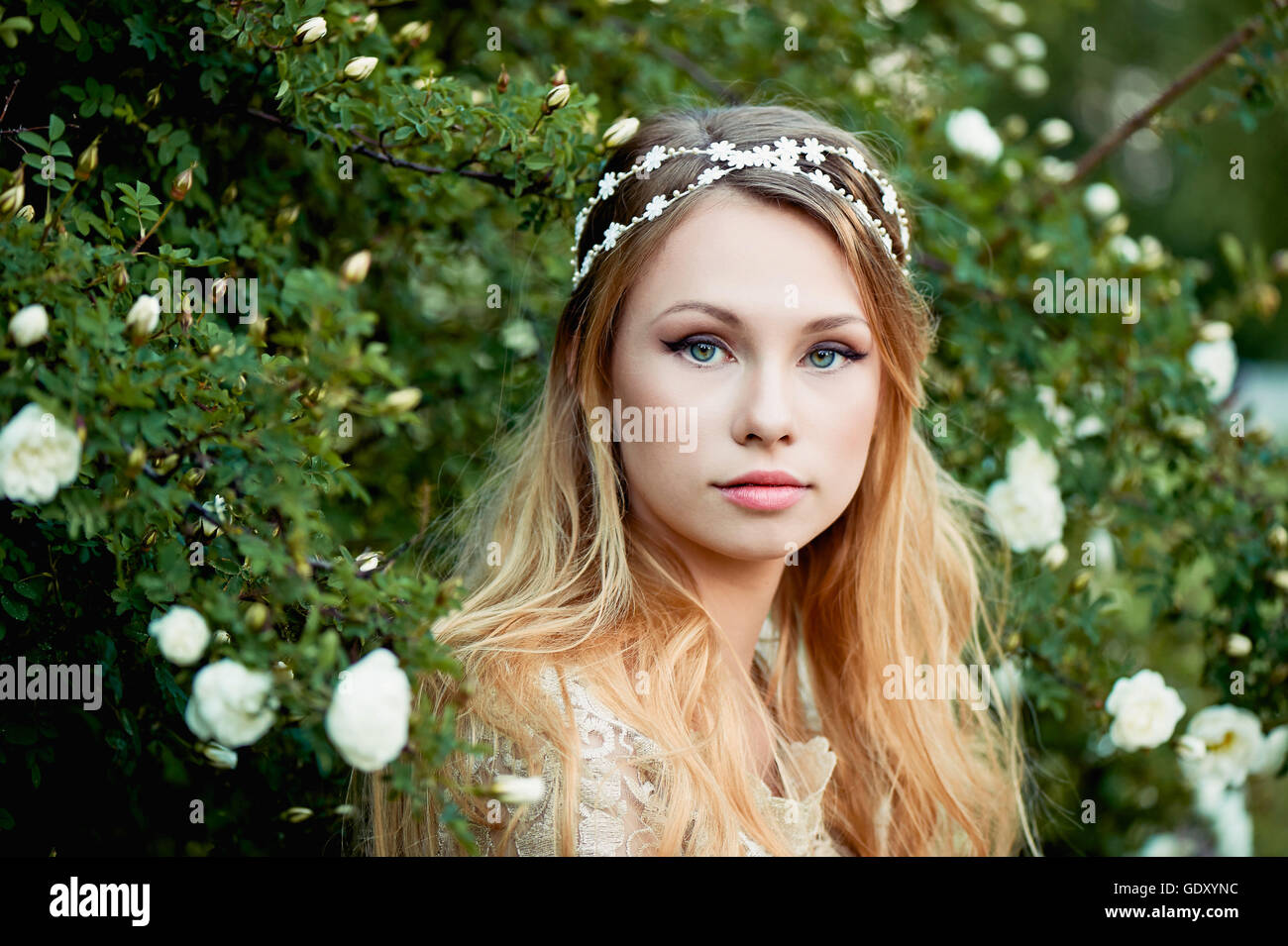Close-up portrait of young girl with long blonde hair. Gentle and ...
