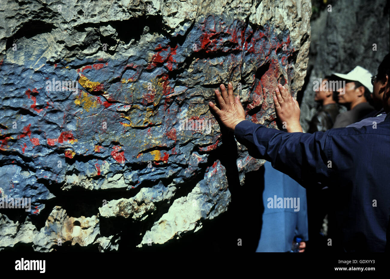 Visitors Making Handprints On A Large Rock At The Stone Forest To Stock Photo Alamy