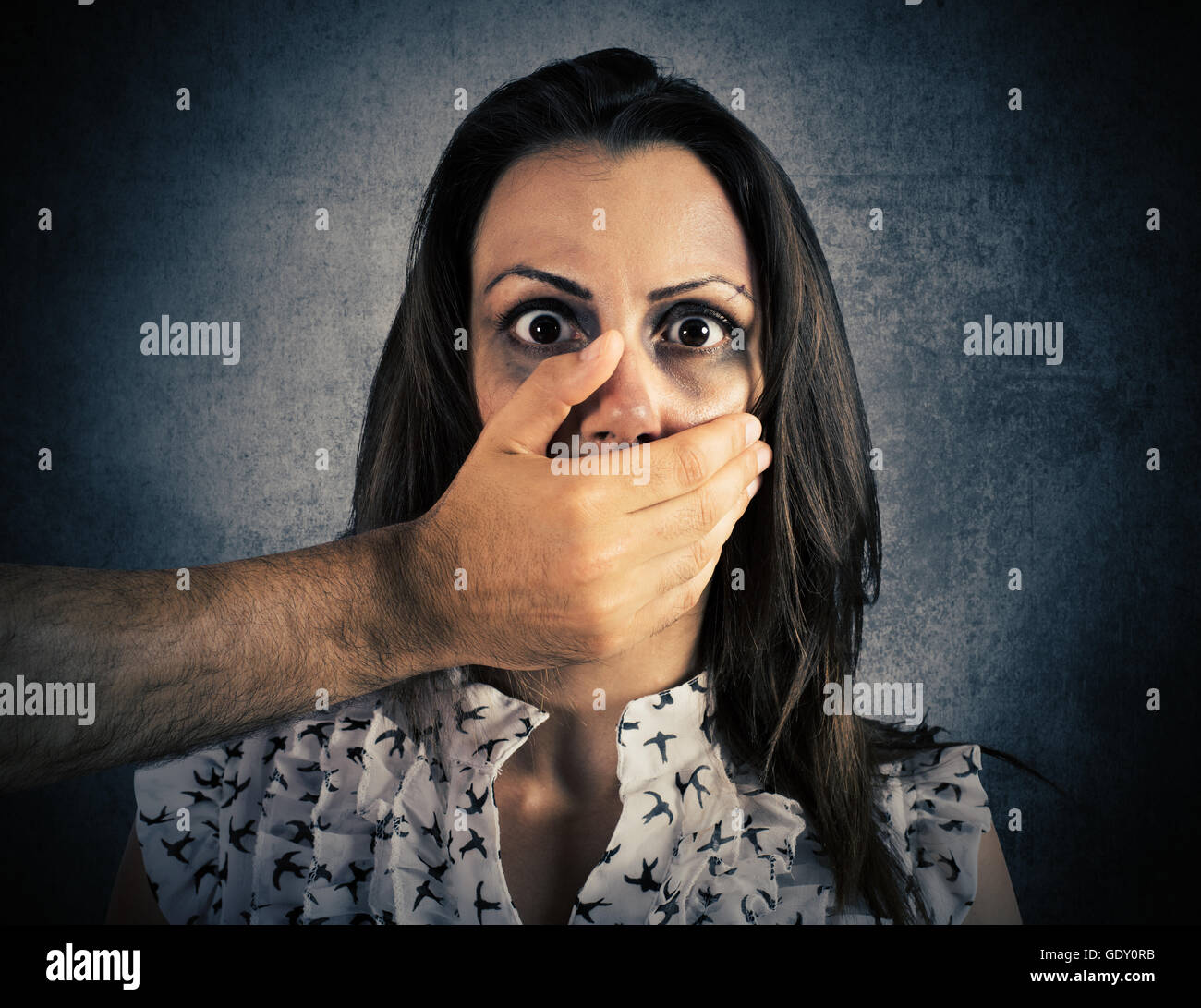 Woman terrified by the violence Stock Photo