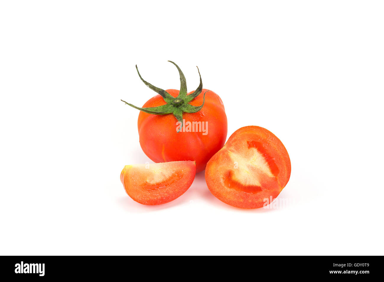 Red tomato and tomato slice isolated on white background Stock Photo