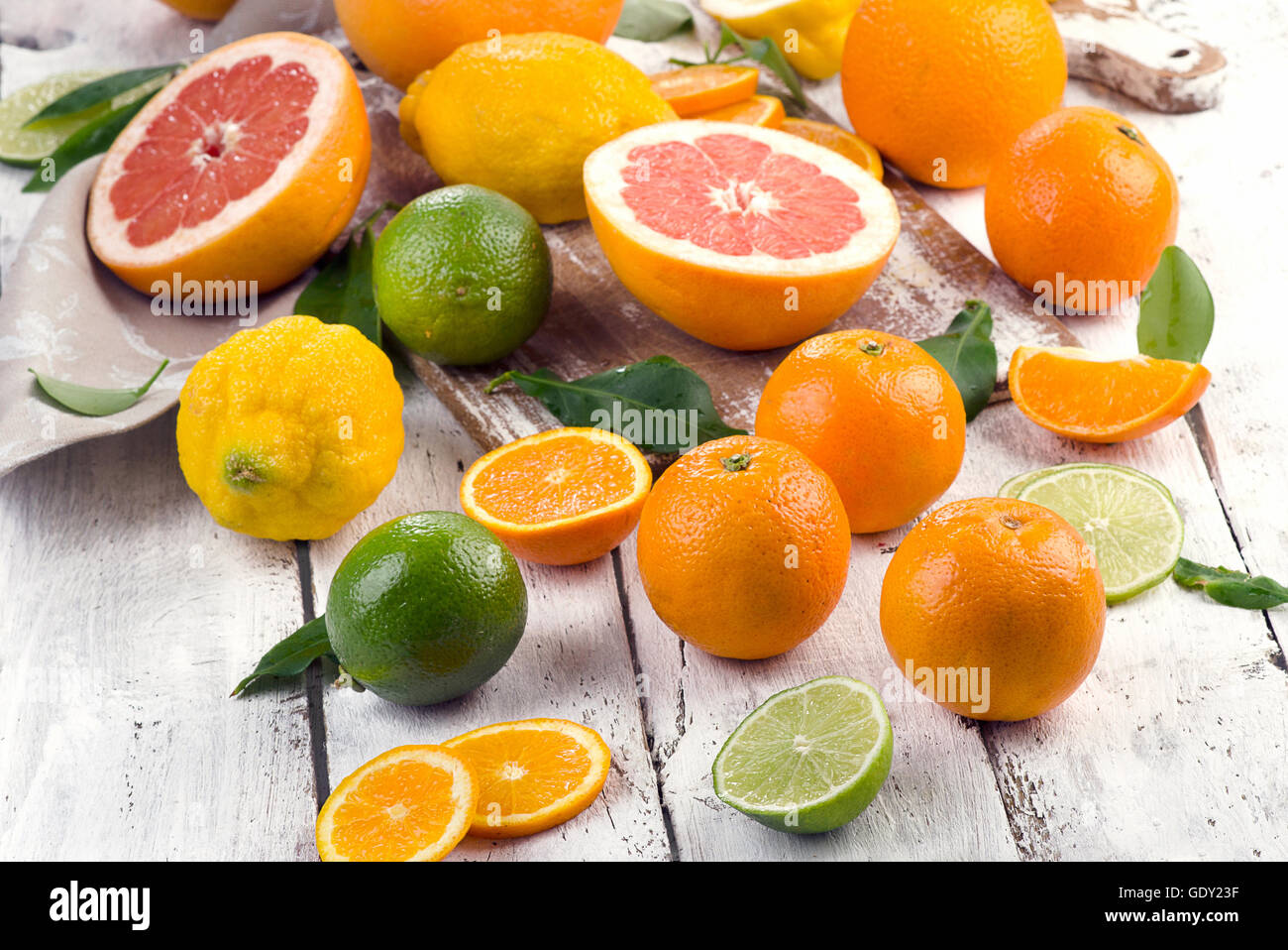 Fresh citrus fruits on a wooden table. Stock Photo