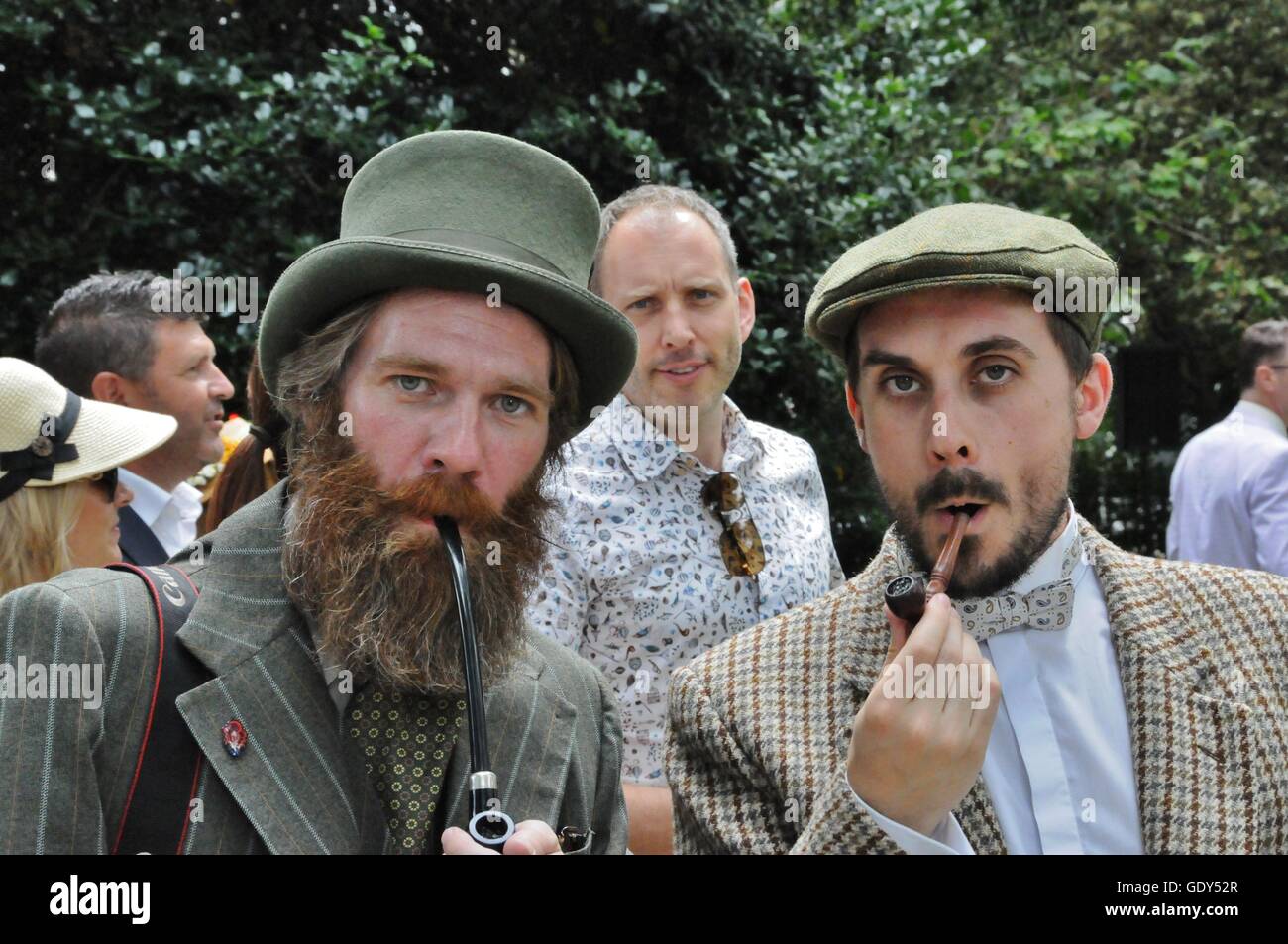 Two bearded men smoking pipes, at the 2016 Chap Olympiad in London's Bedford Square. Stock Photo