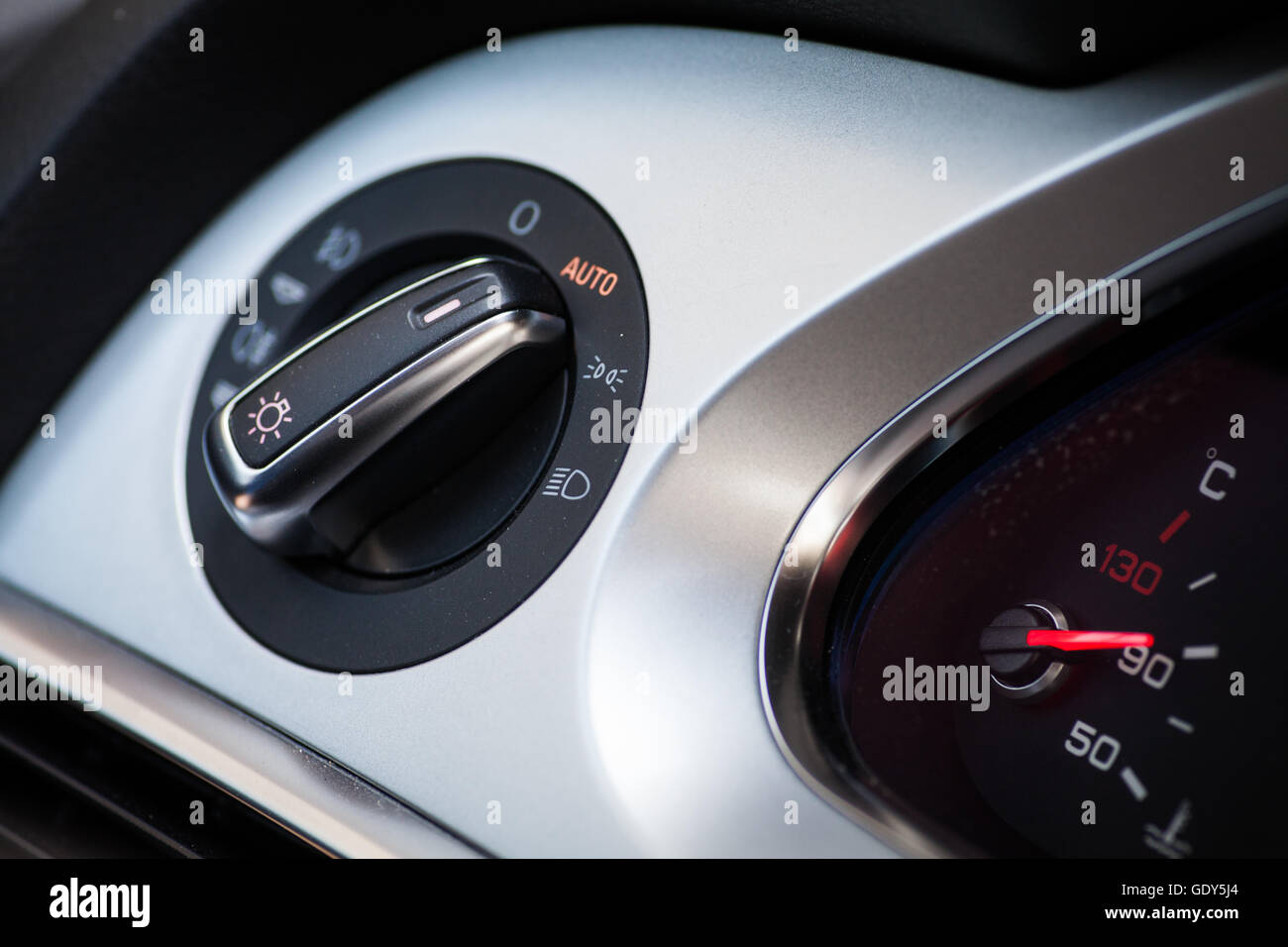 Close up shot of the headlights button in a car Stock Photo - Alamy