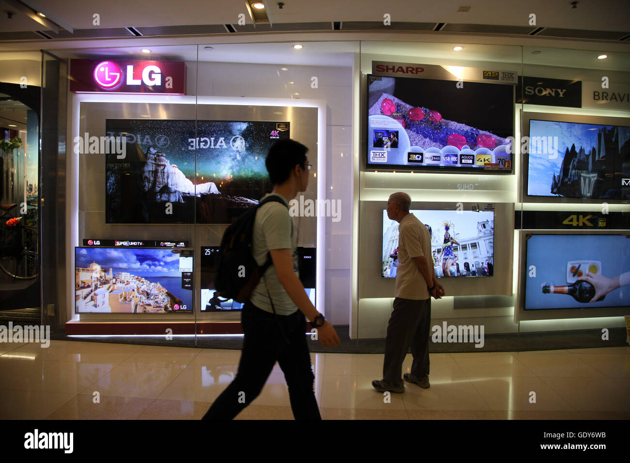 People looking at LG TVs in LG shop in IFC shopping mall central Hong