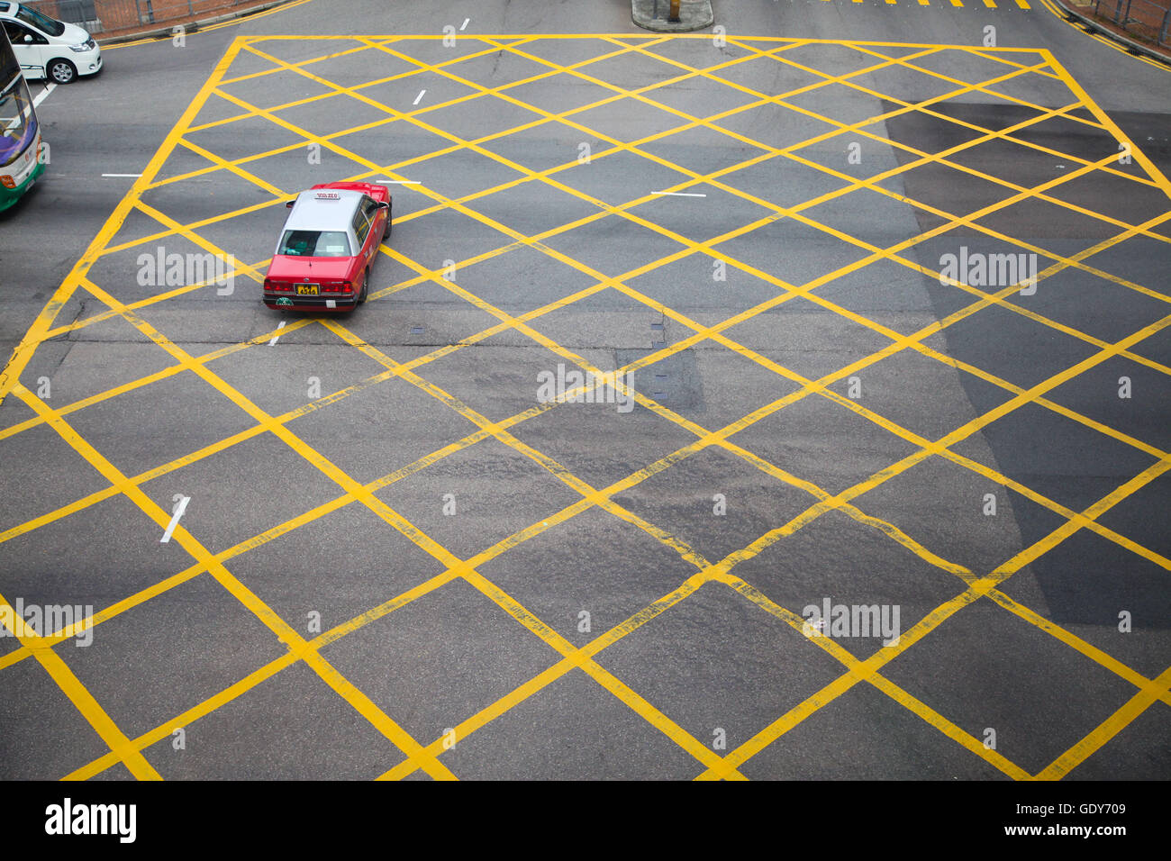 Red Hong Kong taxi in yellow box junction in Central District of Hong Kong,  China, Asia Stock Photo - Alamy