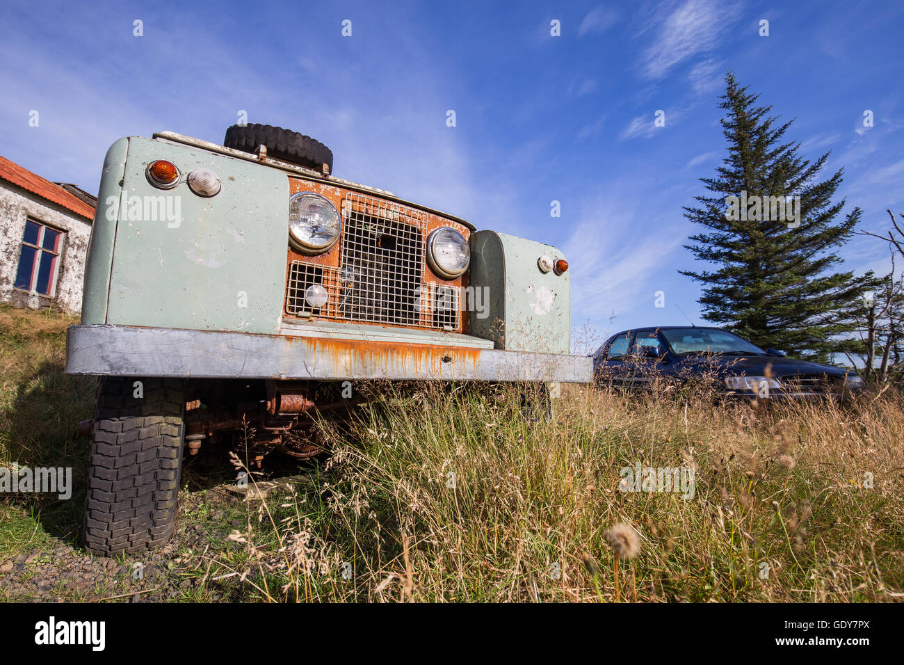 Run down cars at an old run down farm in Iceland Stock Photo