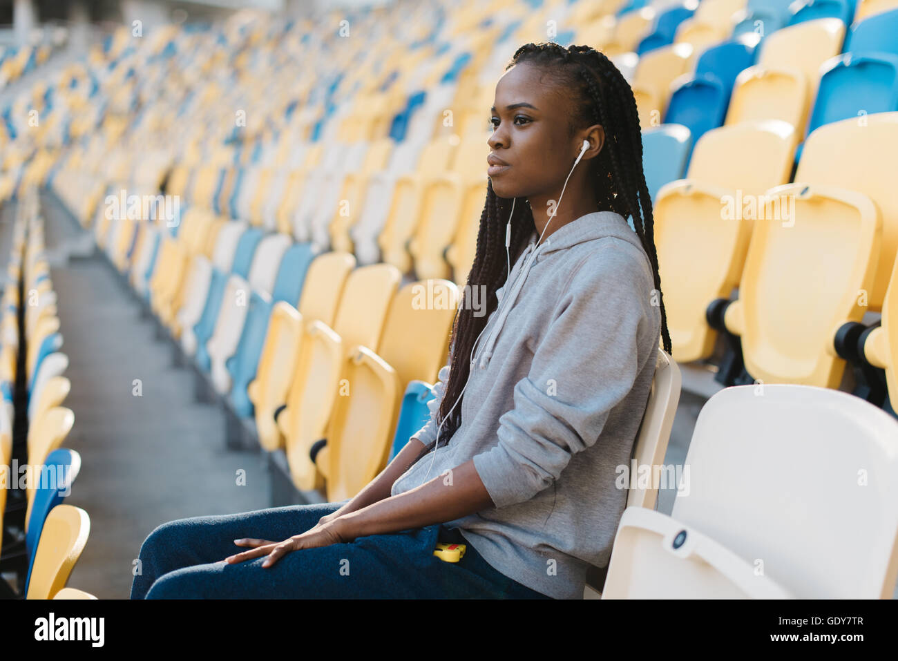 African woman sitting alone side view hi-res stock photography and ...