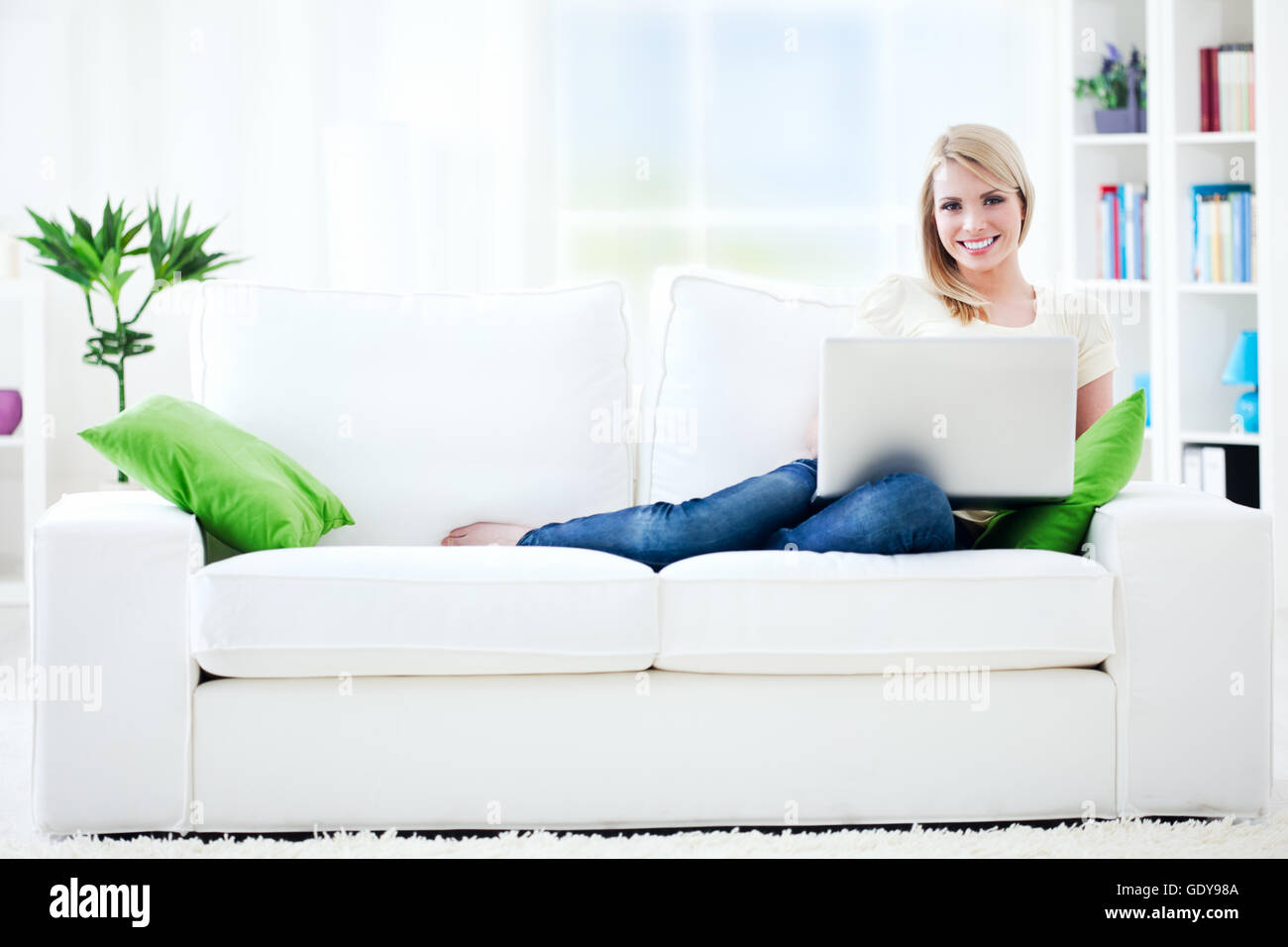 Beautiful young woman working at home. Stock Photo