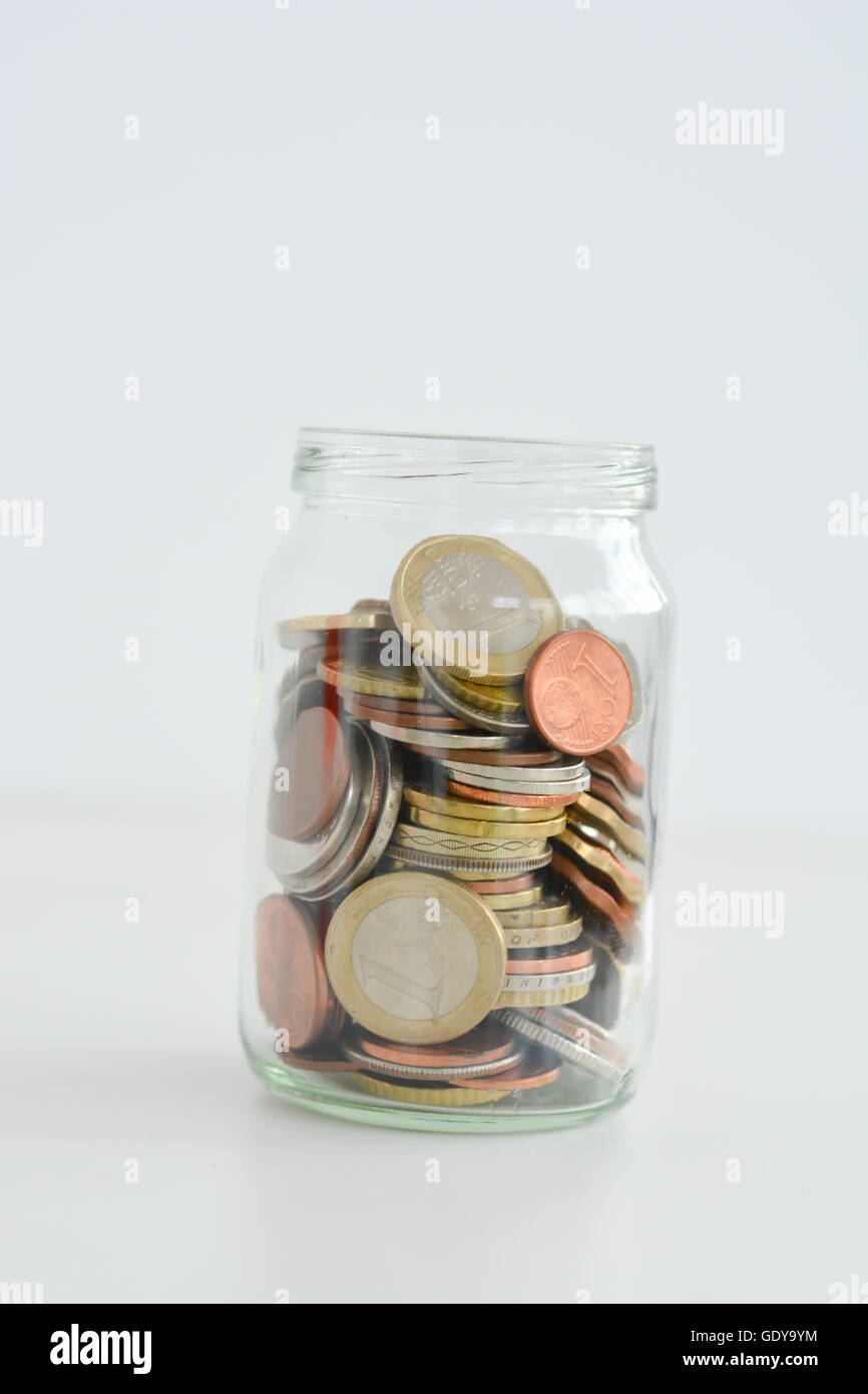 Retirement plan concept illustrated with coins and a jar Stock Photo
