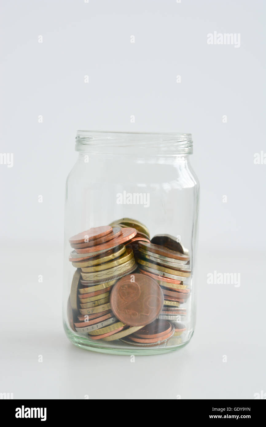 Retirement plan concept illustrated with coins and a jar Stock Photo