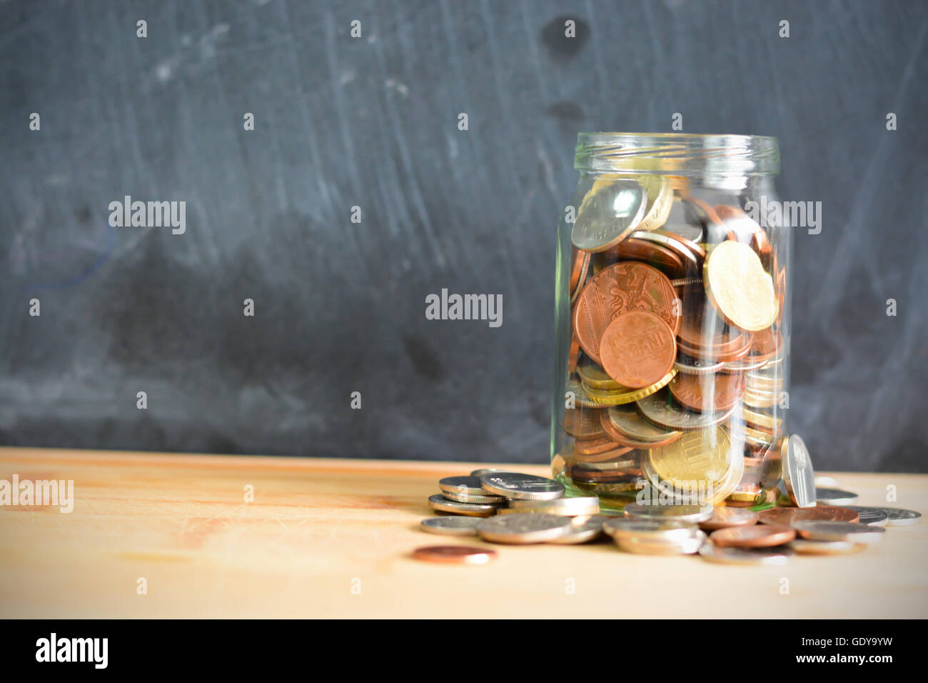 Personal savings concept illustrated with money in a jar Stock Photo