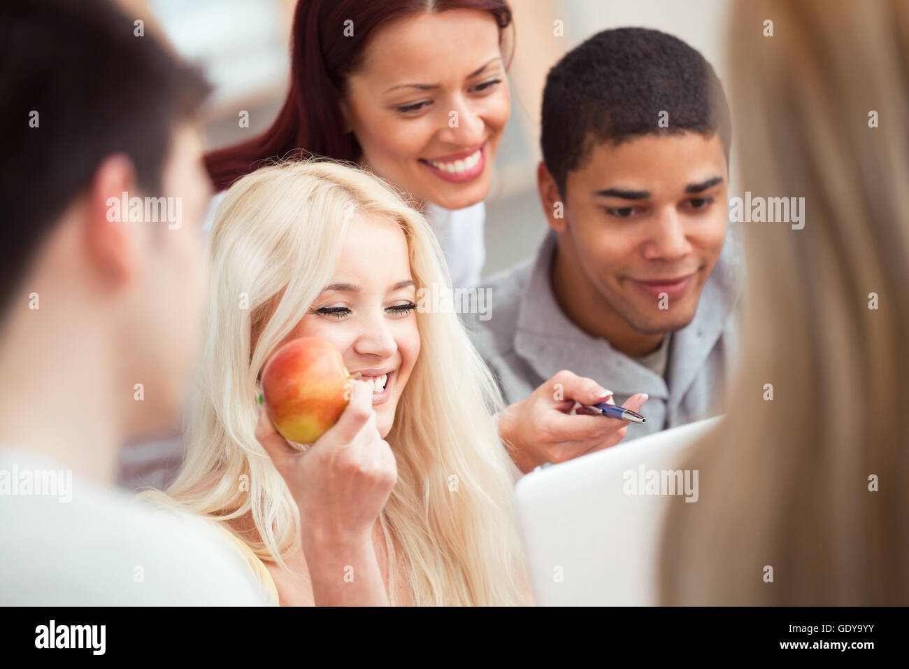 Teacher working with students. Stock Photo