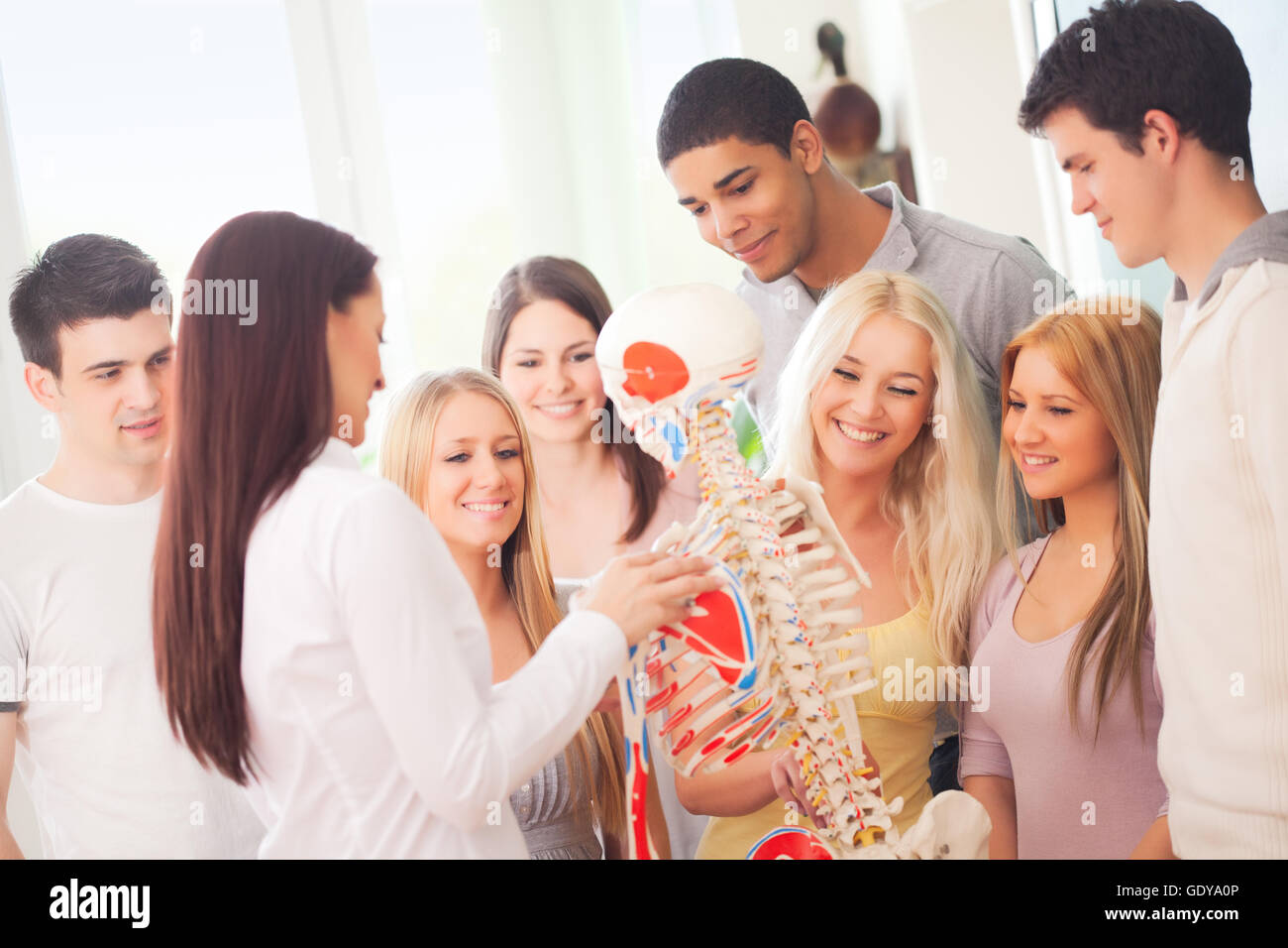 Anatomy teacher and her students during a lesson Stock Photo Alamy