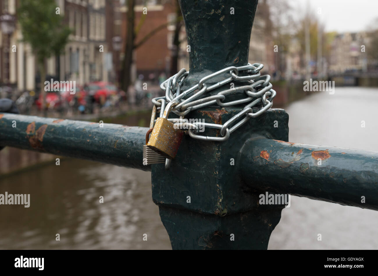 metal chain lock on a bridge in amsterdam, netherlands Stock Photo