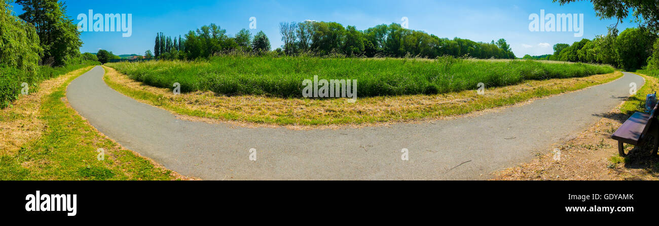 panorama of bike path in the park Stock Photo - Alamy